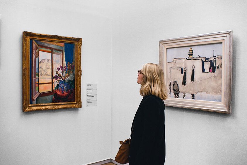 a woman viewing an exhibition